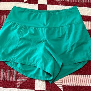 Women’s CVG green running shorts